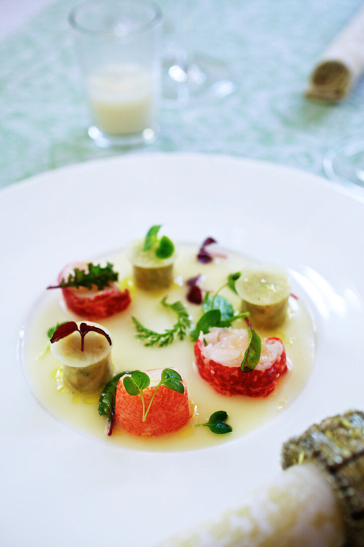 Close-up of lobster with medlar and vinaigrette on plate