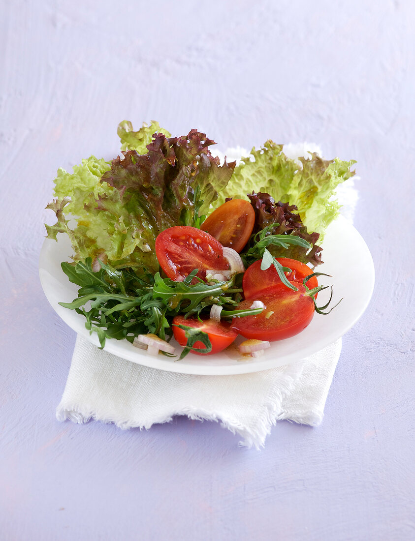 Salad with tomato on plate