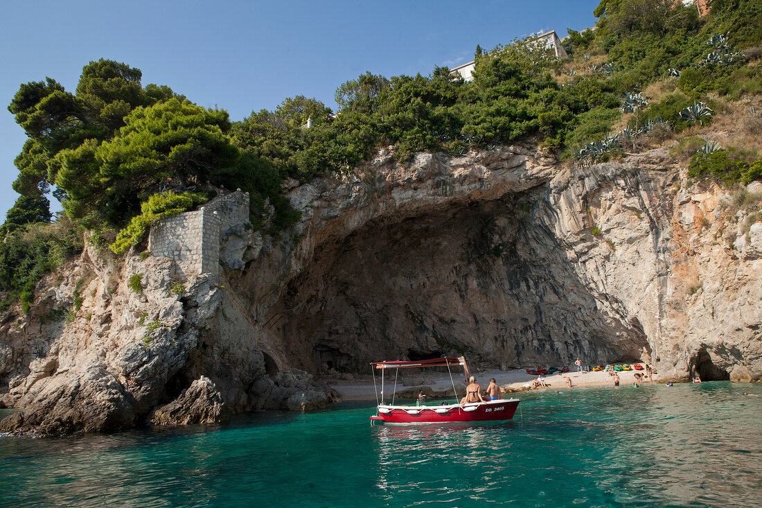 View of cave and boat in sea, Dubrovnik, Croatia