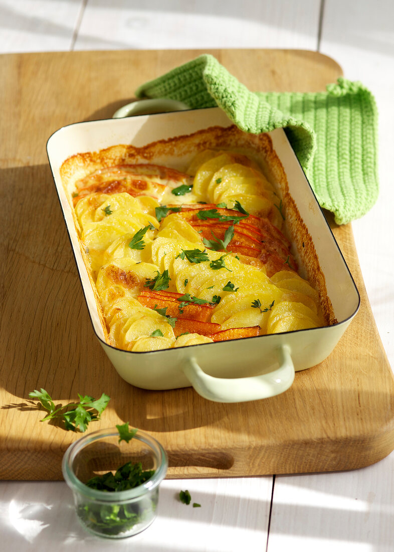 Potato and pumpkin gratin in serving dish