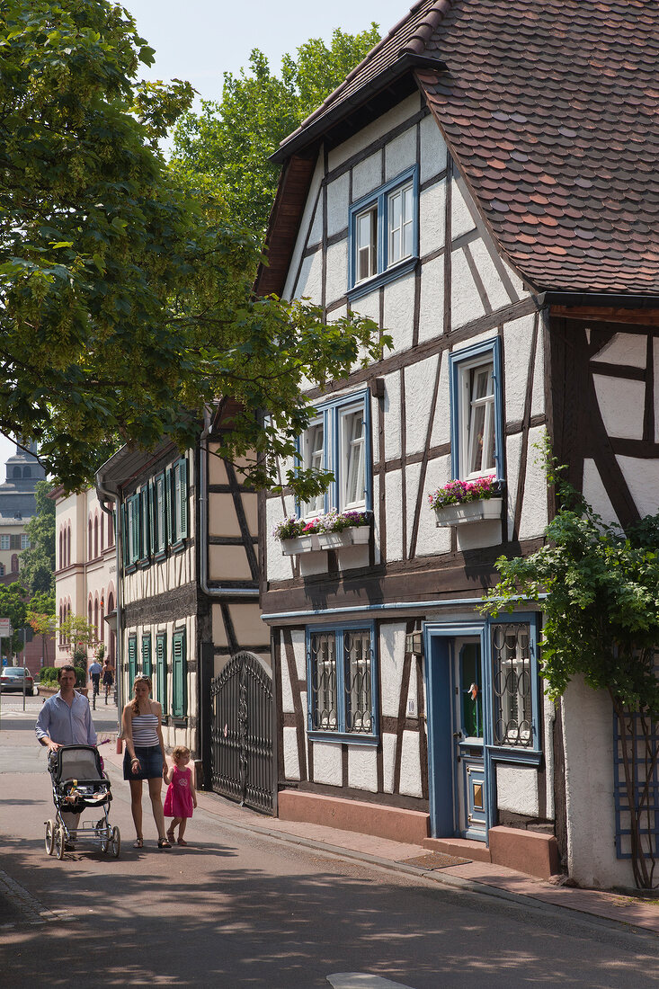 Tourist Walking in front of Fachwerkaus house in old town, Bad Homburg, Germany