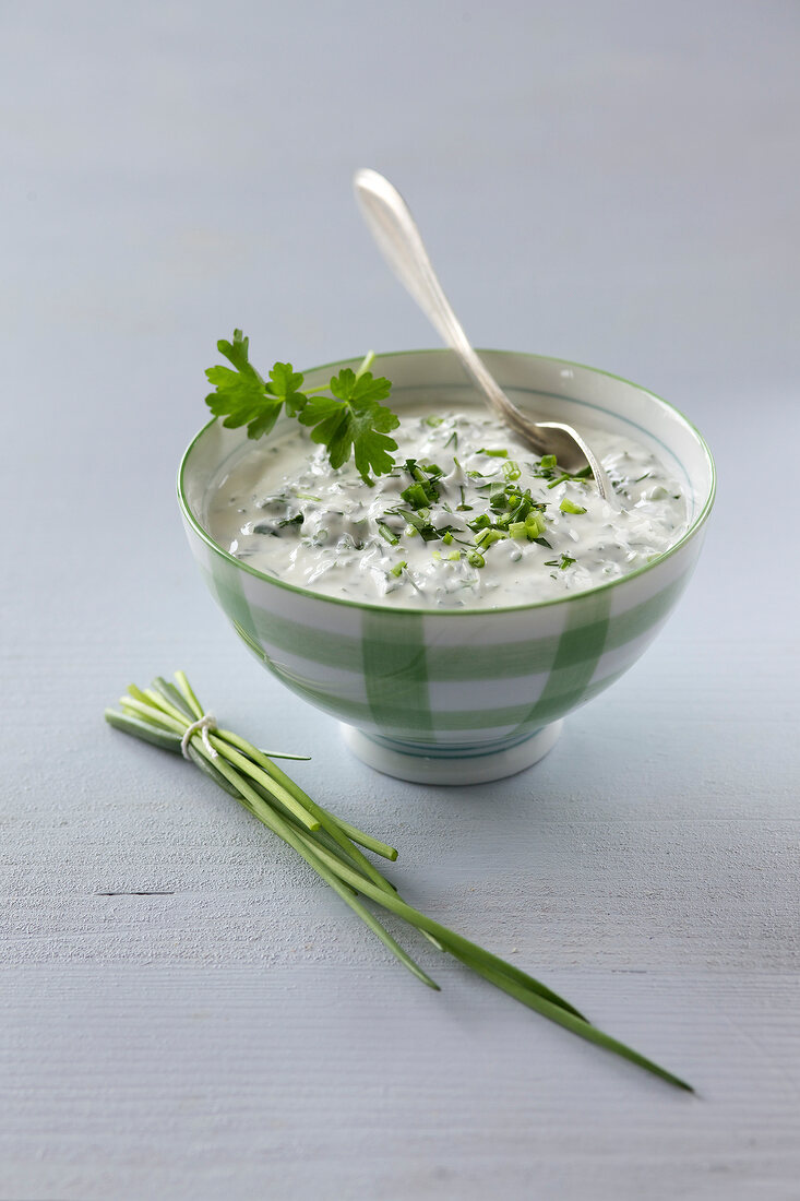 Bowl of sour cream with herbs