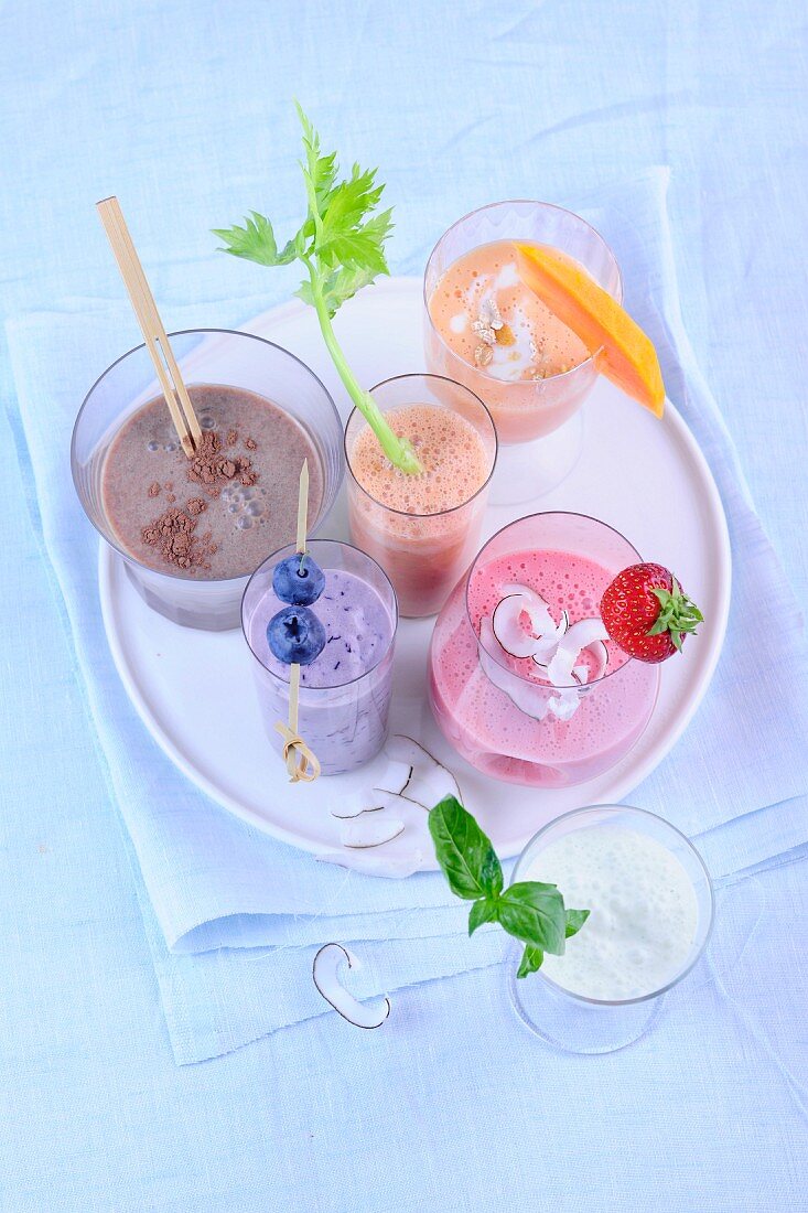 Various shakes and smoothies on a tray