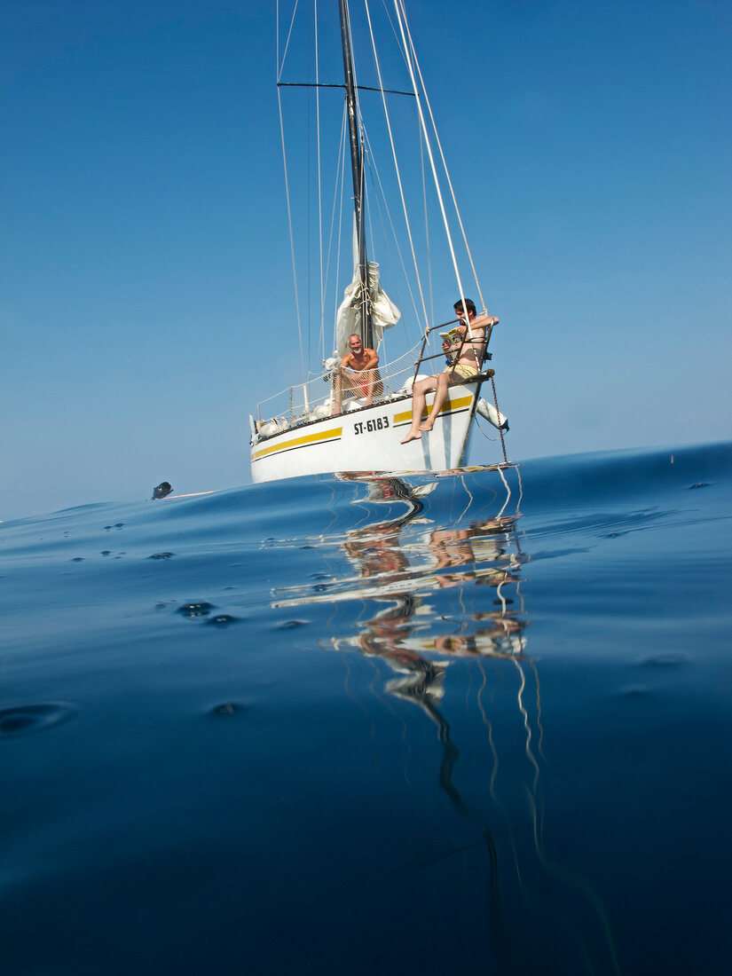 Two men on sailing boat in Croatia