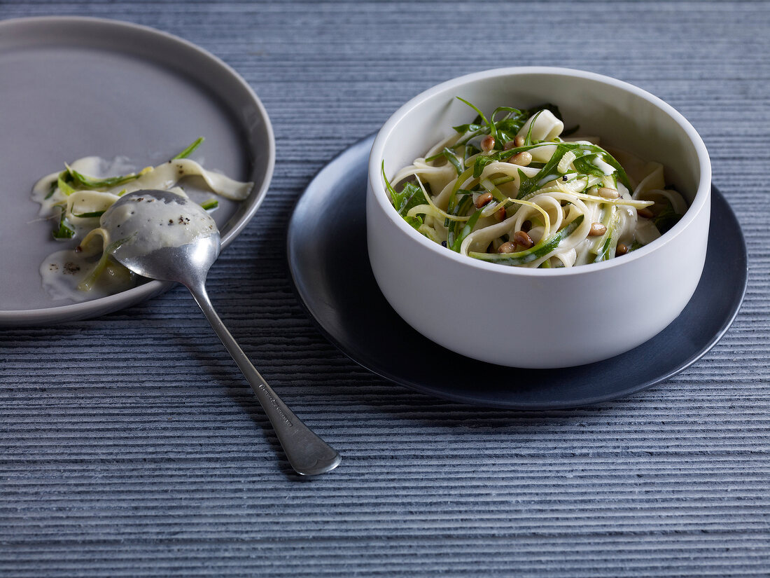 Pappardelle pasta with zucchini and lemon sugo in bowl