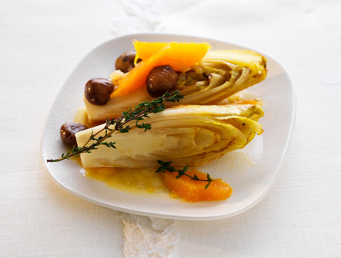 Endives with chestnuts on plate