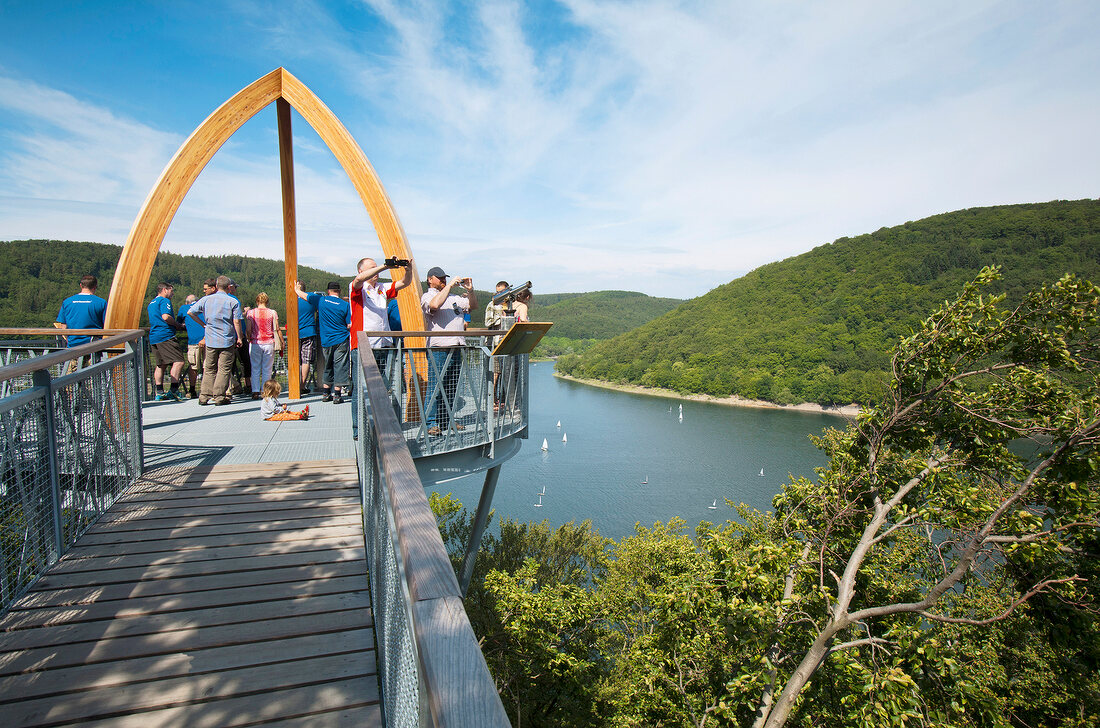 Tourists on Tree Top Walk bridge at Lake Eder, Hemfurth-Edersee, Hesse, Germany