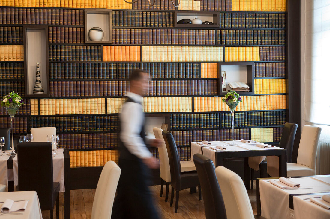 Waiter walking in Zagreb Restaurant, Croatia, blurred motion