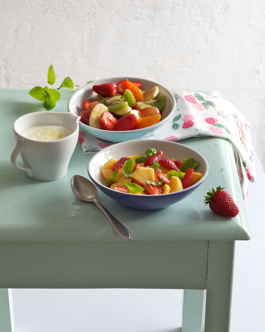 Bowls of two different fruit salads