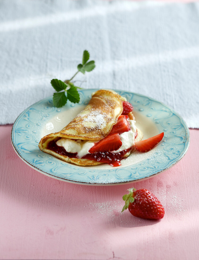 Strawberry pancakes on plate