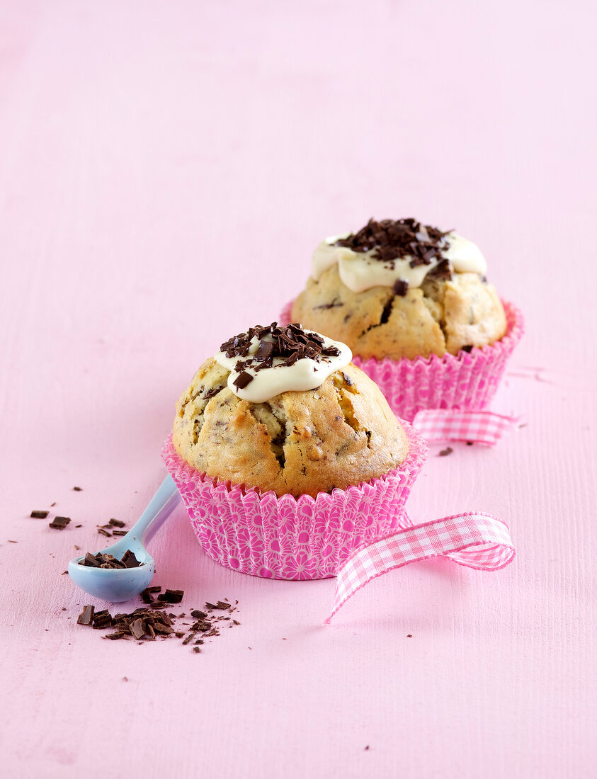Stracciatella muffins on pink background