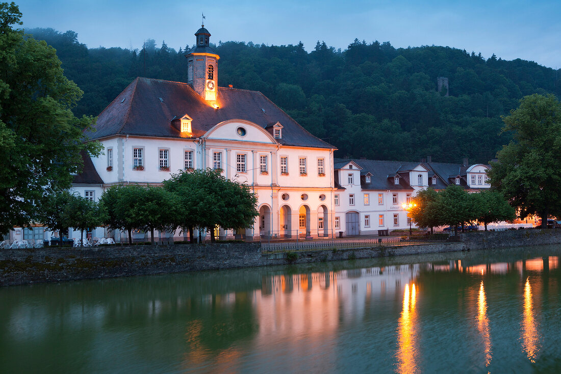 View of illuminated Landgrave Carl-channel at dusk in Bad Karlshafen, Hesse, Germany