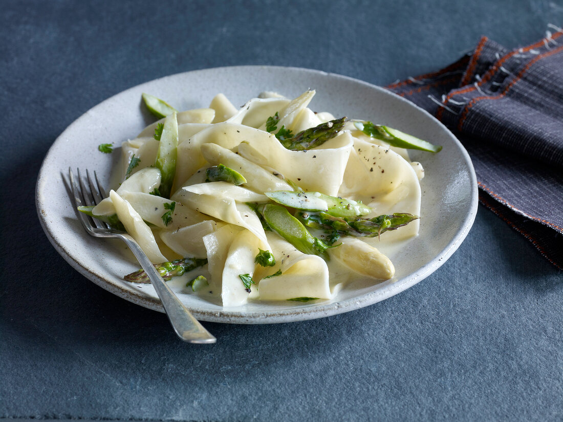 Pappardelle with asparagus and chervil sauce on plate