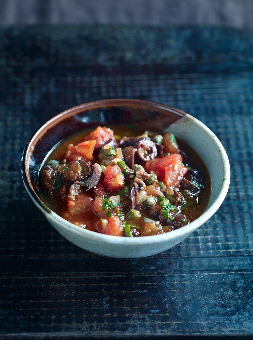 Spicy tomato sauce with papers, olives, chillis and anchovies