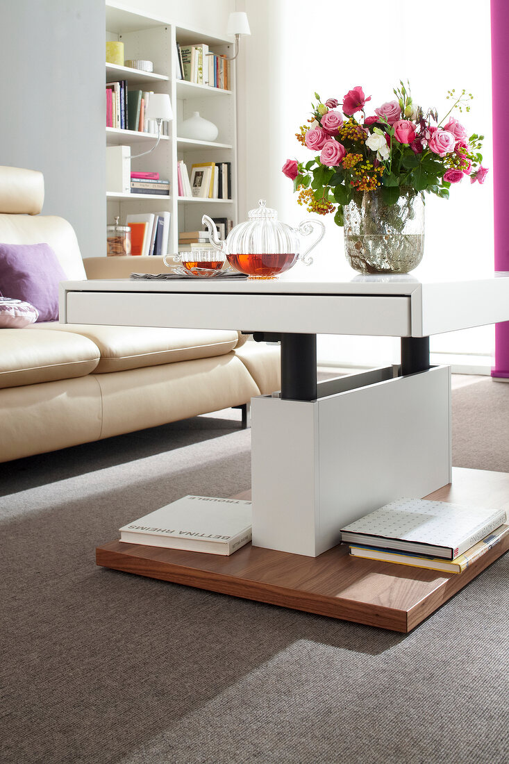 Table with adjustable height, lacquer plate, walnut base and flower vase