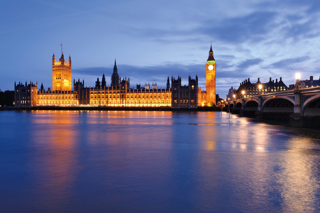 View of Houses of Parliament at Westminster, Big Ben and river Thames at dusk, London, UK