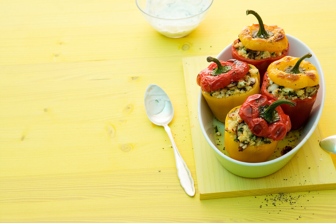 Peppers filled with chilli couscous in serving dish
