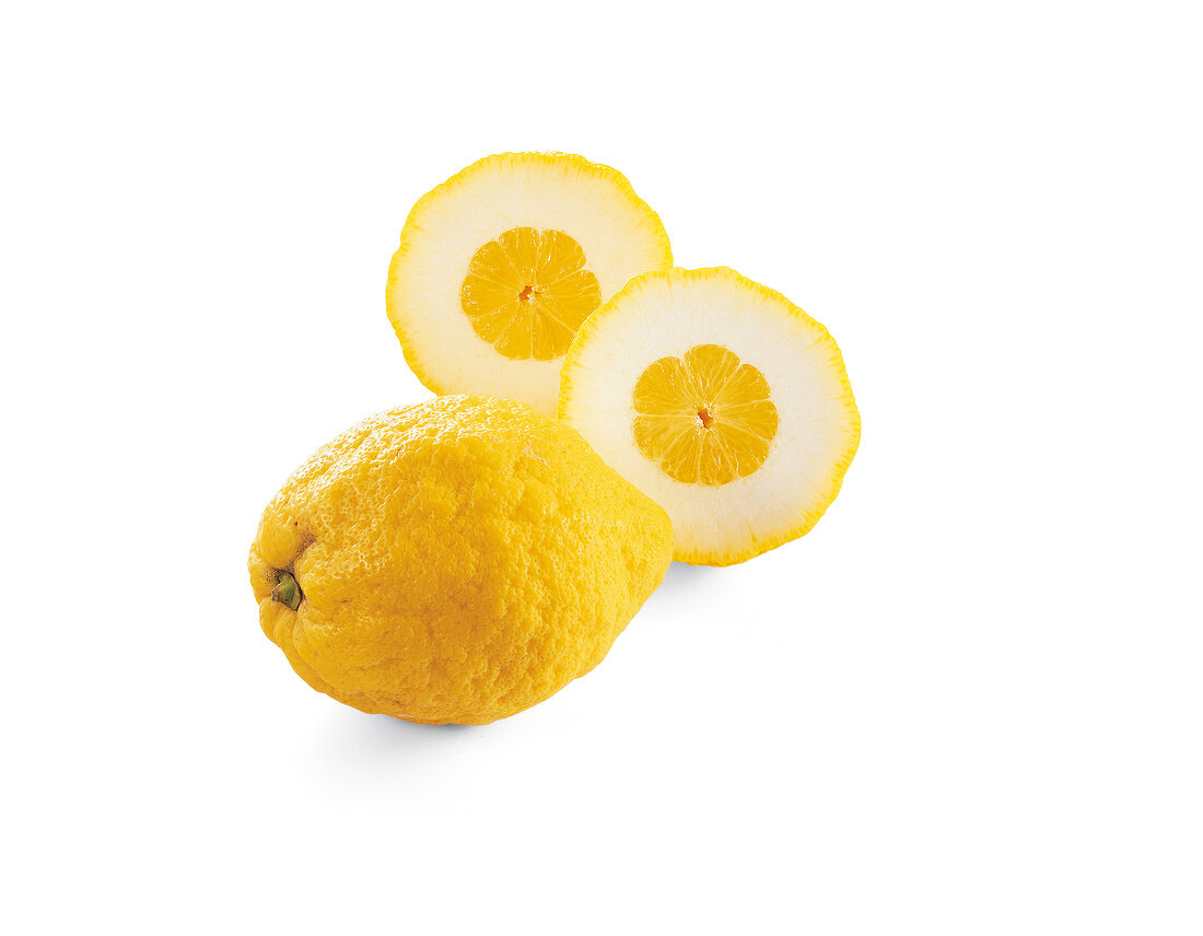 Two sliced and whole lemons on white background