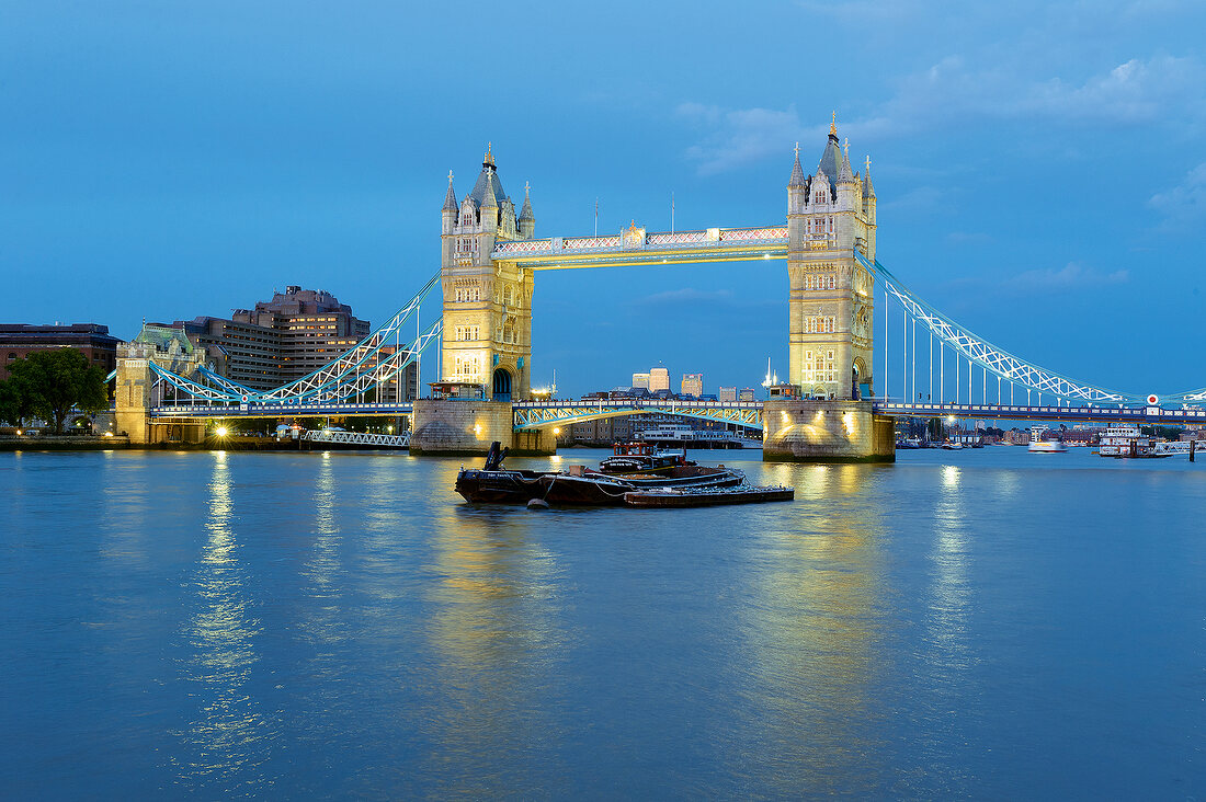 View of illuminated Tower Bridge on River Thames, Southwark, London, UK