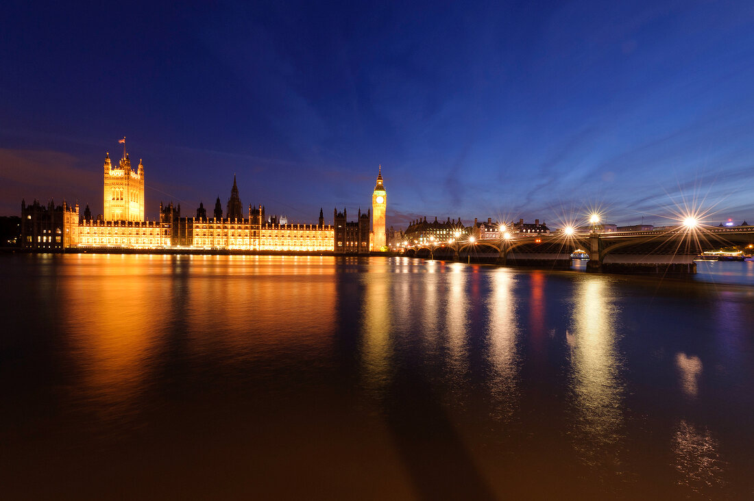View of Houses of Parliament at Westminster, Big Ben and river Thames at dusk, London, UK