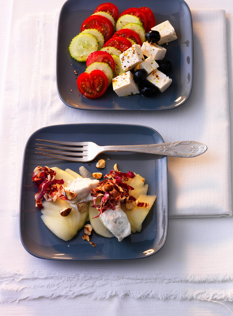Gorgonzola cream with pears, tomatoes, cucumber and feta on plates
