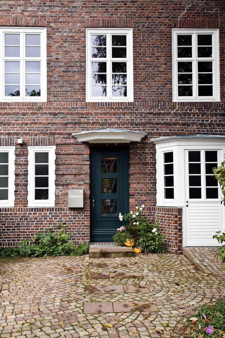 Entrance of house with windows