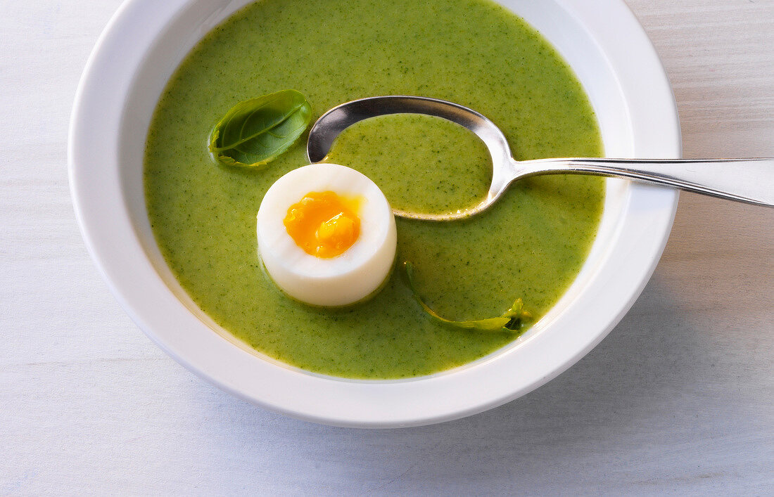 Romanesco soup with soft egg in bowl