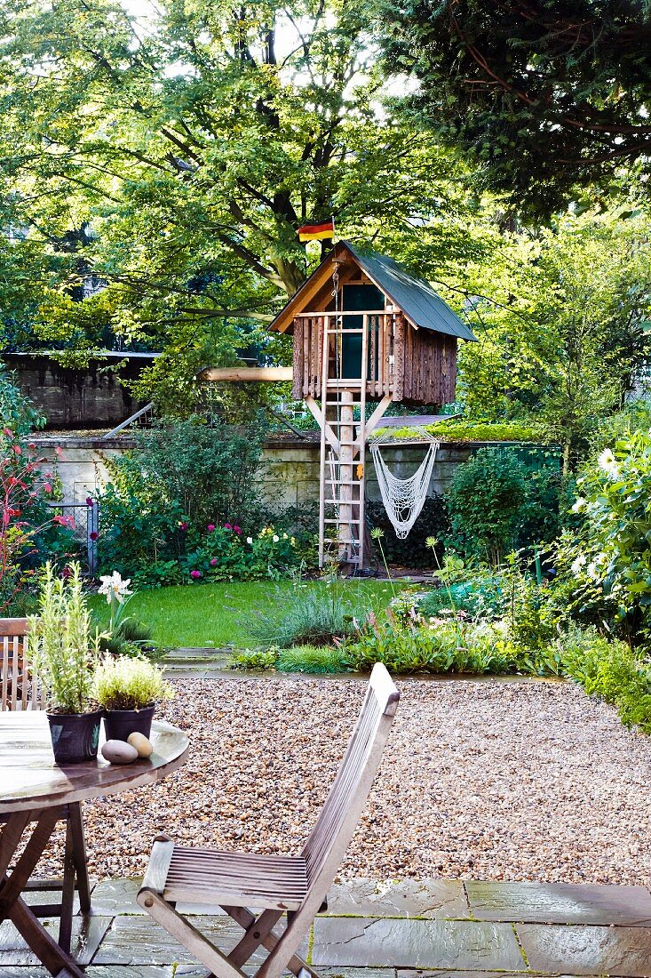 Garden with terrace & small tree house