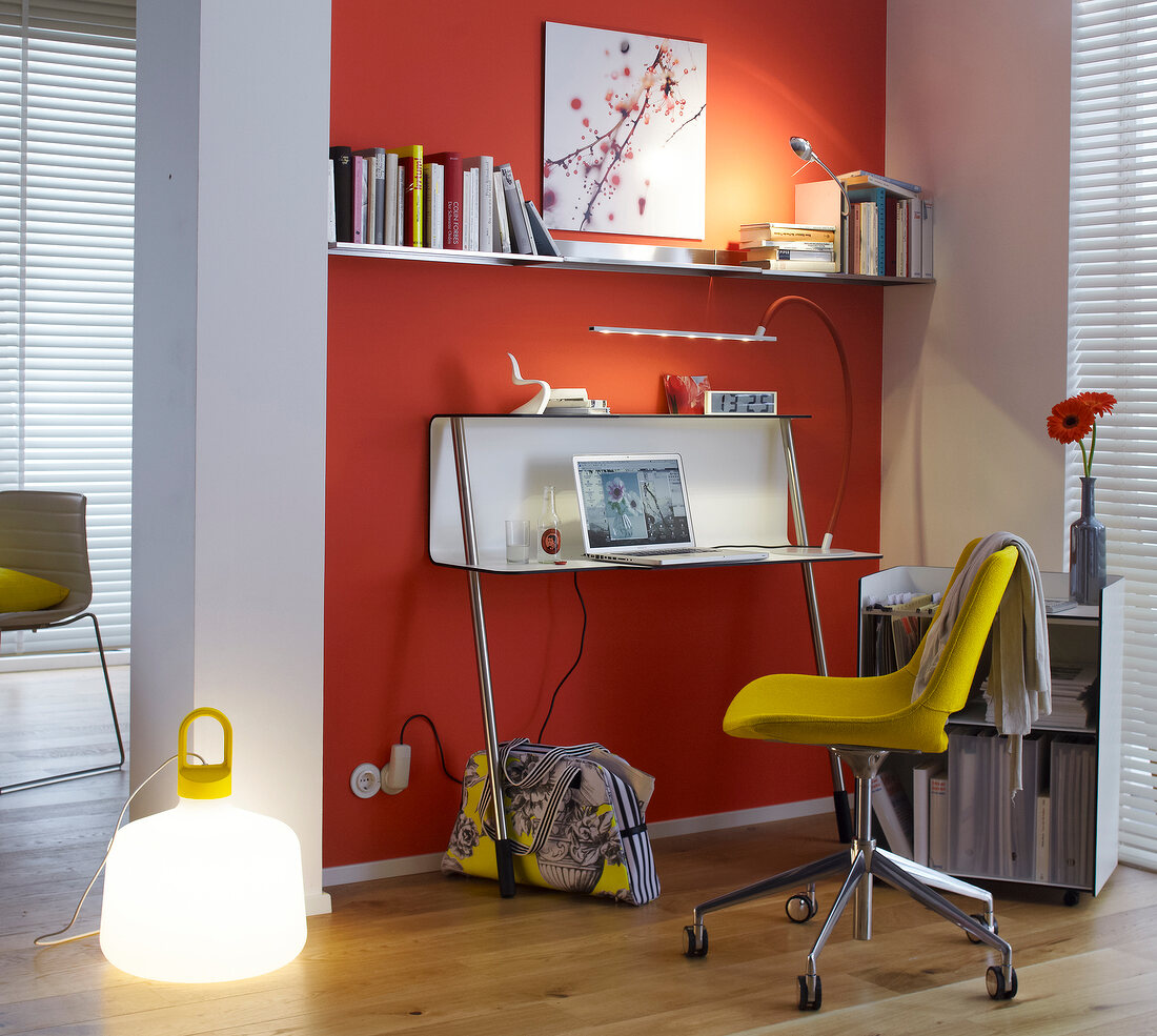 Desk with laptop, chair, lamp and shelf