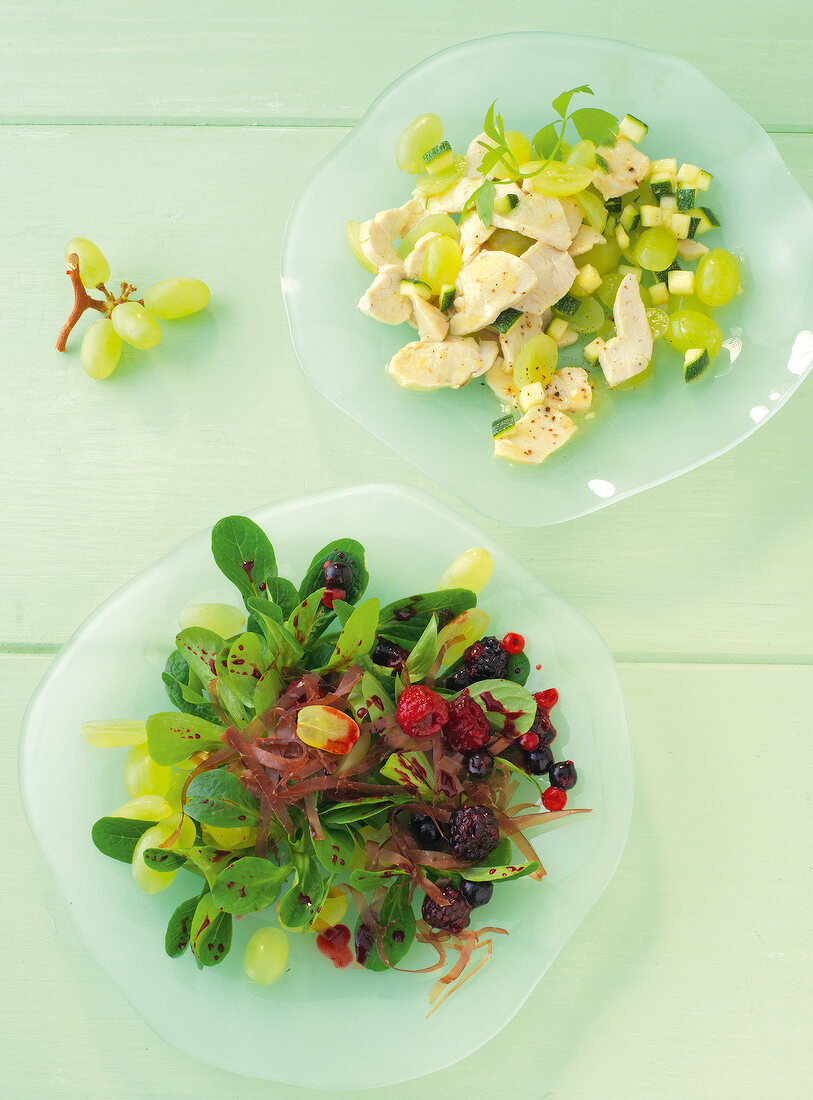 Lamb's lettuce salad and grape salad on plate
