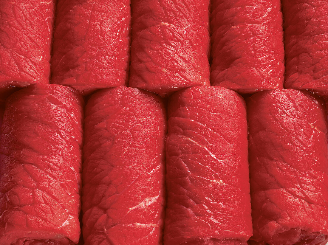 Close-up of raw beef rolls