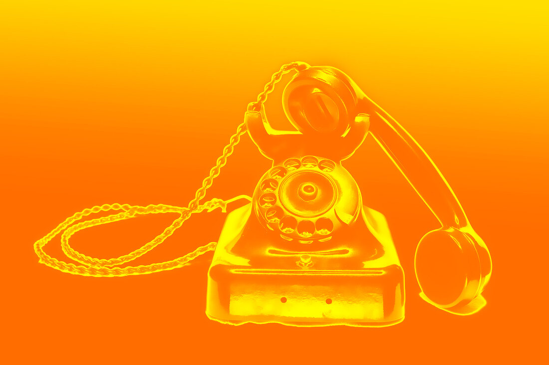 Illustration of old rotary phone against orange background