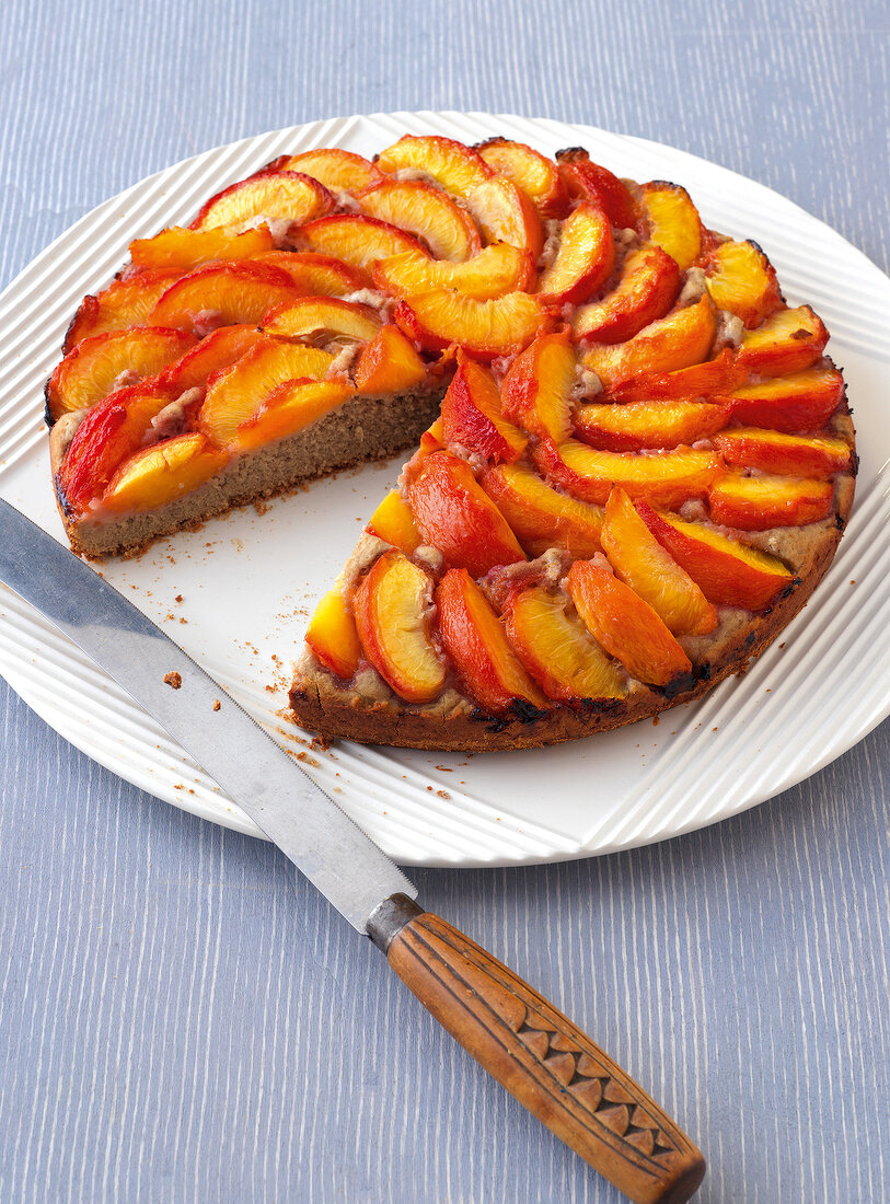 Sweet yeast cake with nectarines on plate