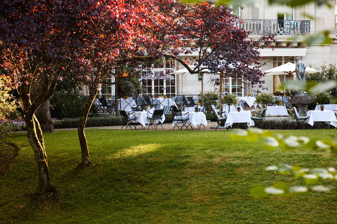 Tables laid in patio of Brenners Park-Hotel and Spa, Baden-Baden, Germany