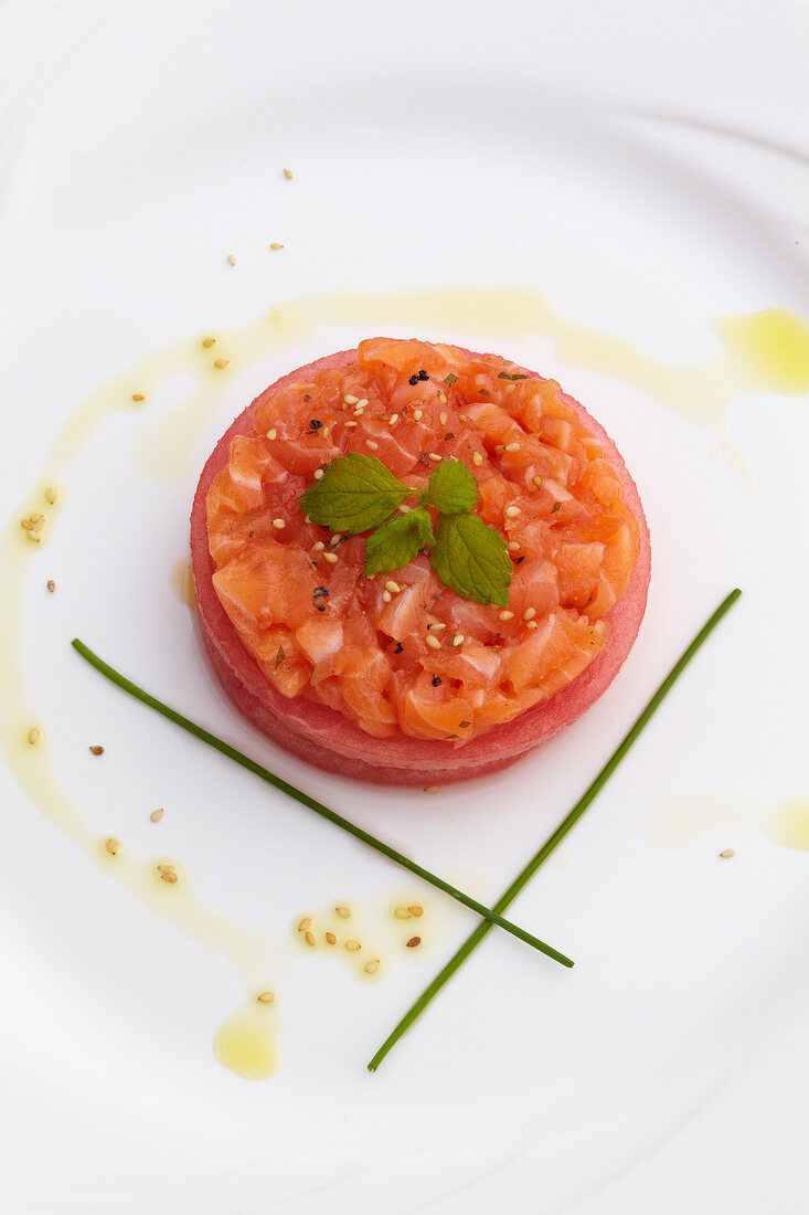 Mille feuille with tartare of raw salmon on plate