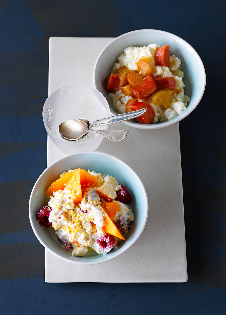 Rhubarb compote and creamy fruit salad in bowls
