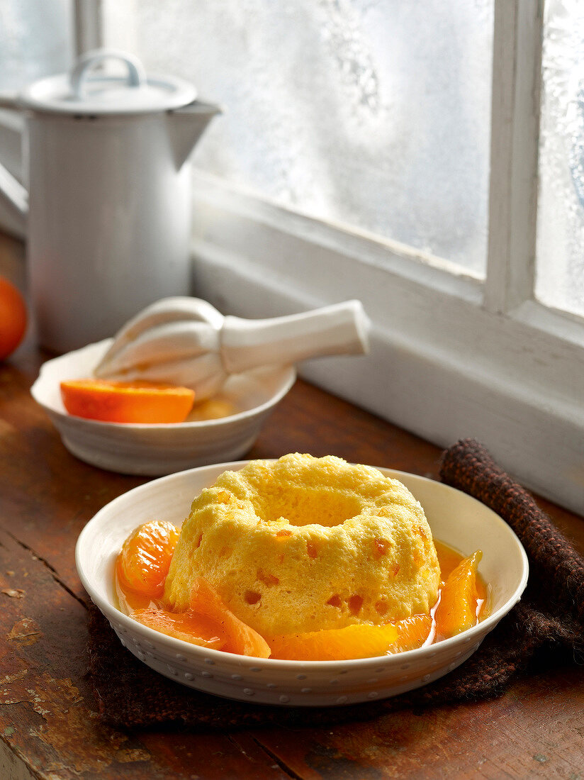 Semolina flummery with orange and mandarins compote in bowl for winter