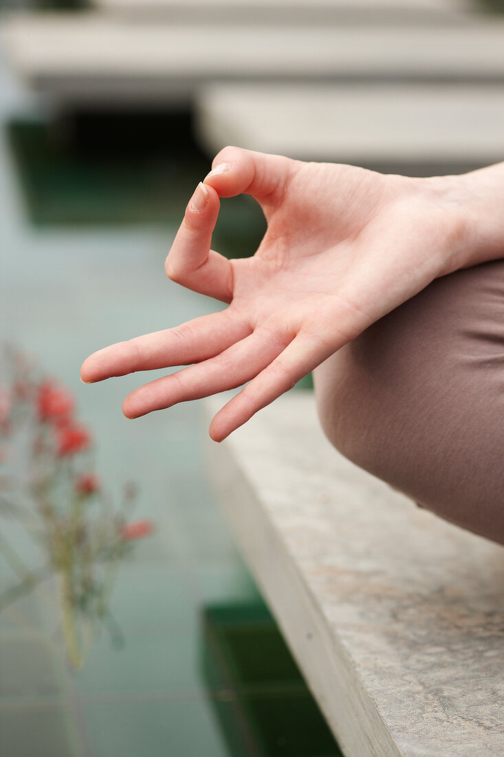 Close-up of woman's hand in gyan mudras