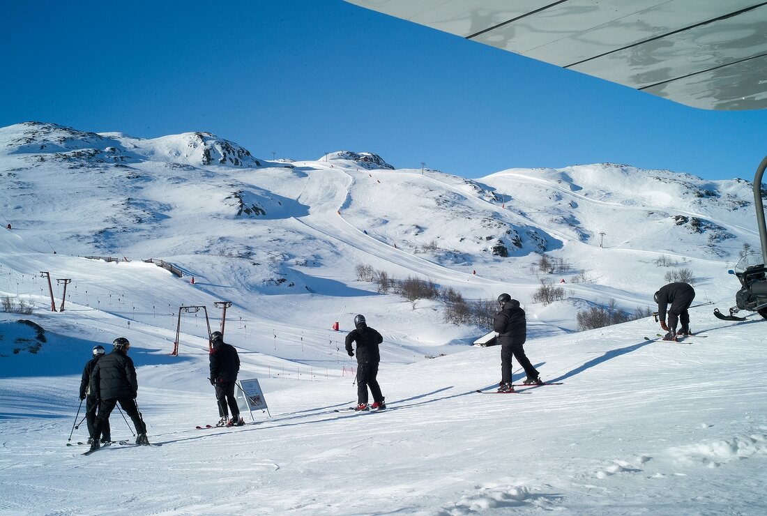 View of skiers skiing downhill in Hemsedal, Norway