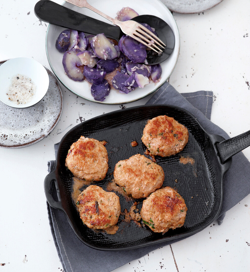 Lamb meat balls with blue potato salad