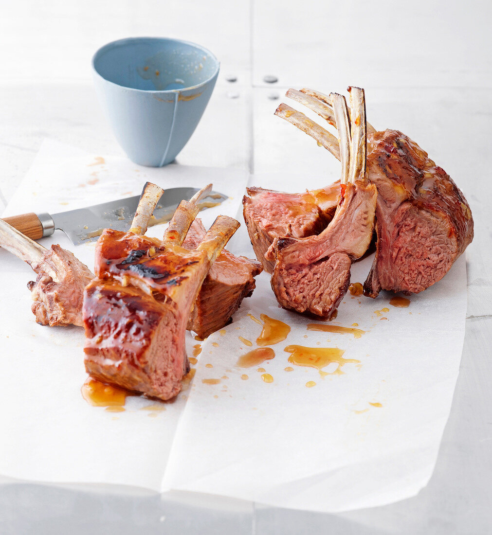 Lamb racks with pineapple marinade on paper