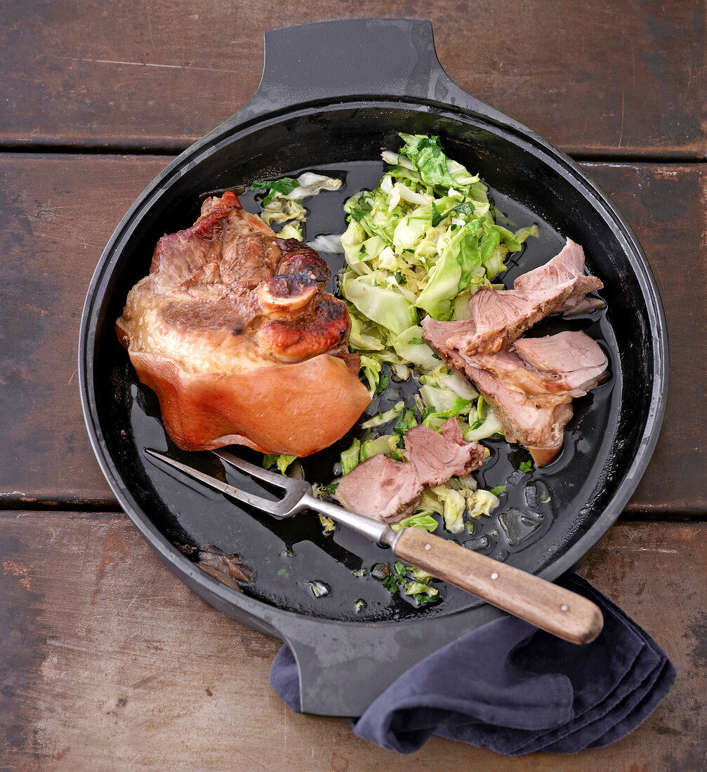 Pig shoulder pork with meat and cabbage in wok