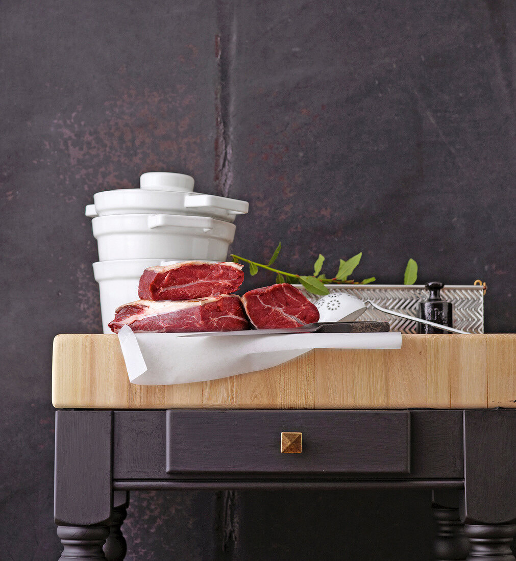 Raw beef slices on kitchen unit