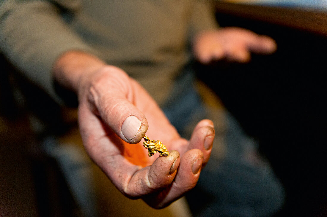 Close-up of gold piece in hand, Hill End, New South Wales, Australia