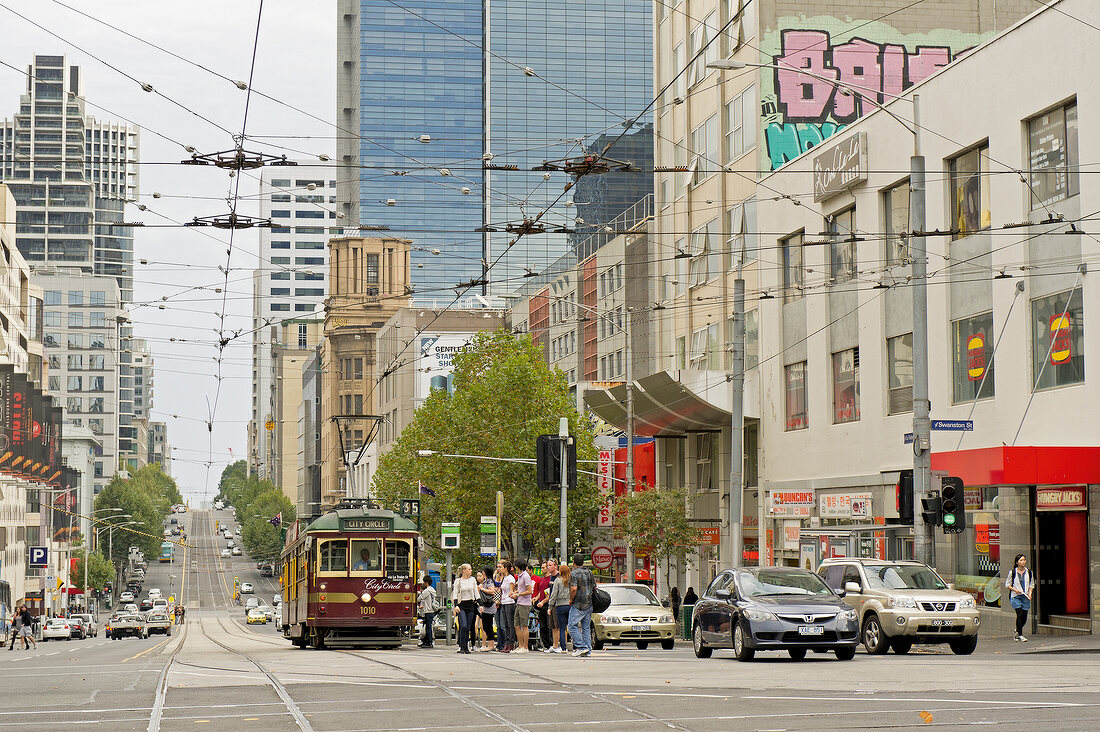 View of State Library of Victoria and tram on road, Melbourne, Victoria, Australia