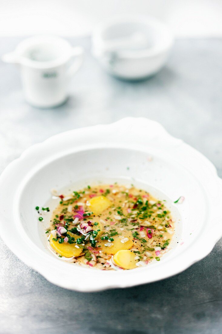 Potato slices in vinaigrette