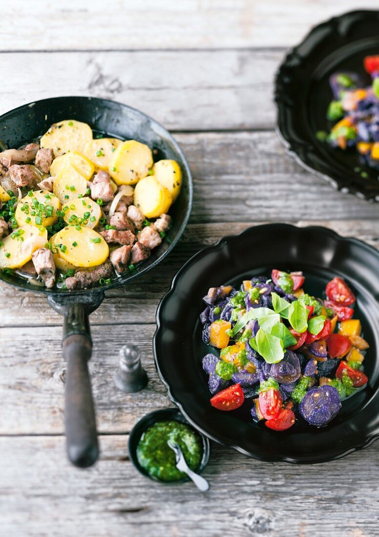 Bäckerin-Salat (warm, filling potato and pork salad) and a blue potato salad