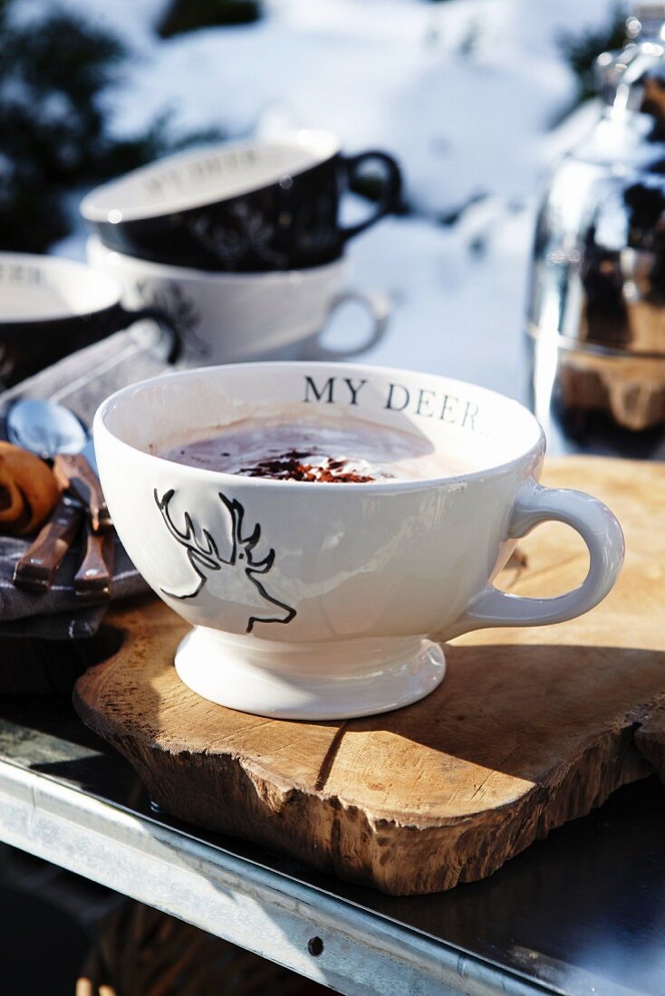 Hot chocolate in a cup with a stag motif