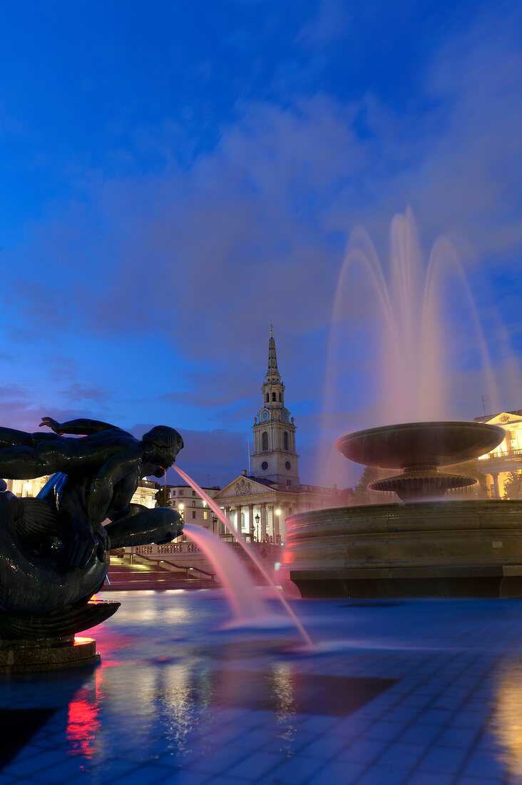 Fountains at Trafalgar Square and St Martin-in-the-Fields in background at London, UK