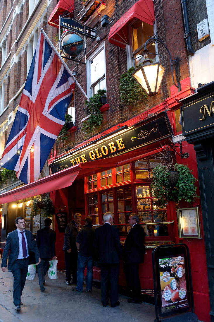 British man drinking Feierabendbier at The Globe Pub in Aldwych, London